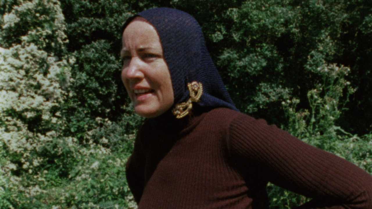 a woman with a knit headscarf